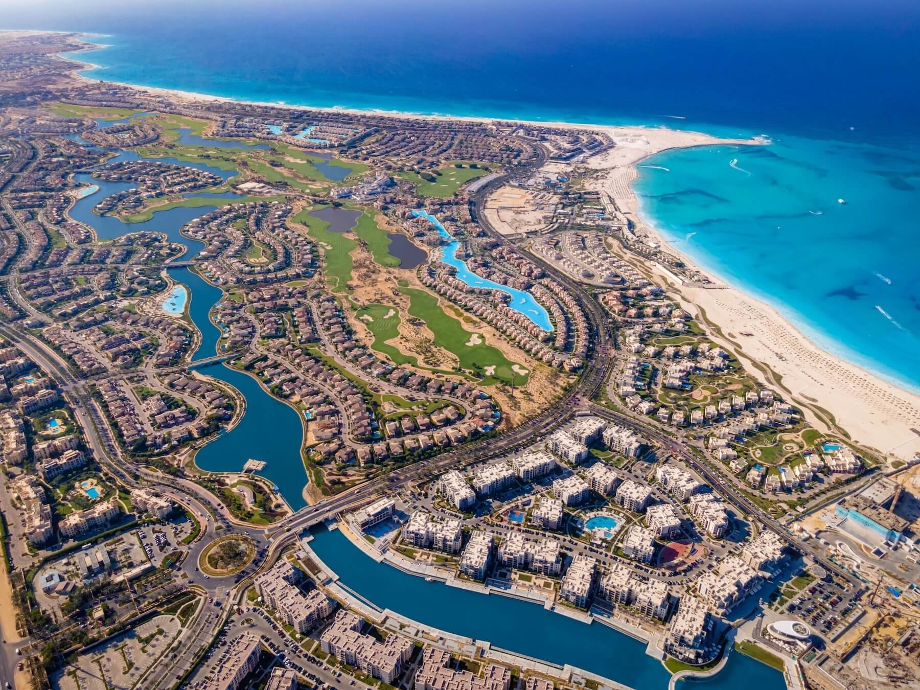 Aerial view of Marassi’s coastline, landscaped lagoons and residences on the North Coast